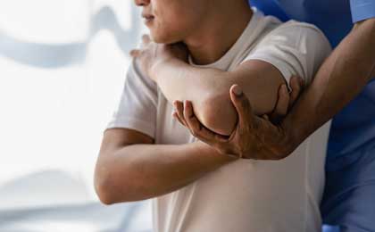 Photo of person working with chiropractor